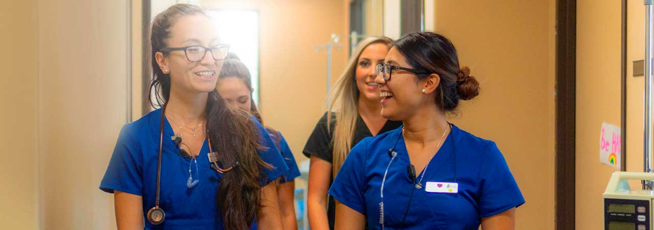 Nurses walking through a hallway